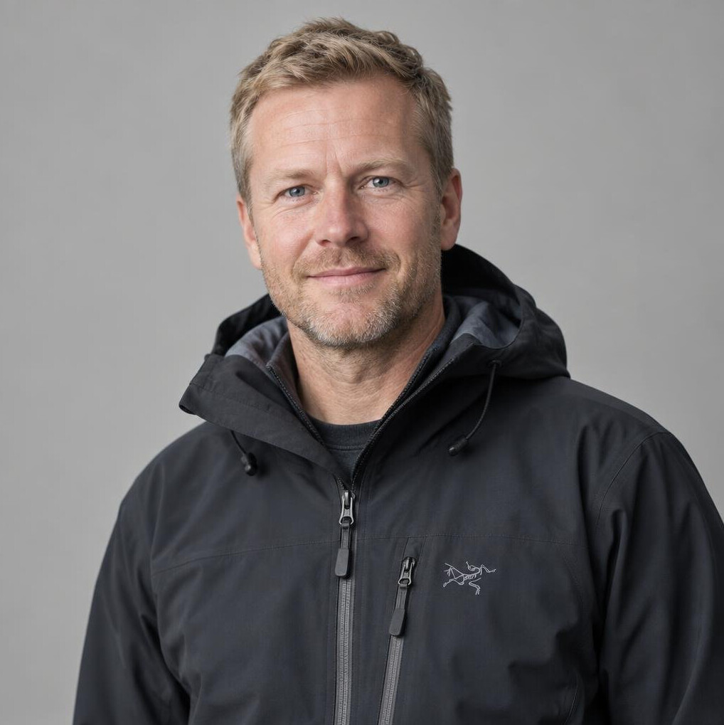 Portrait of a man with short hair in a dark jacket