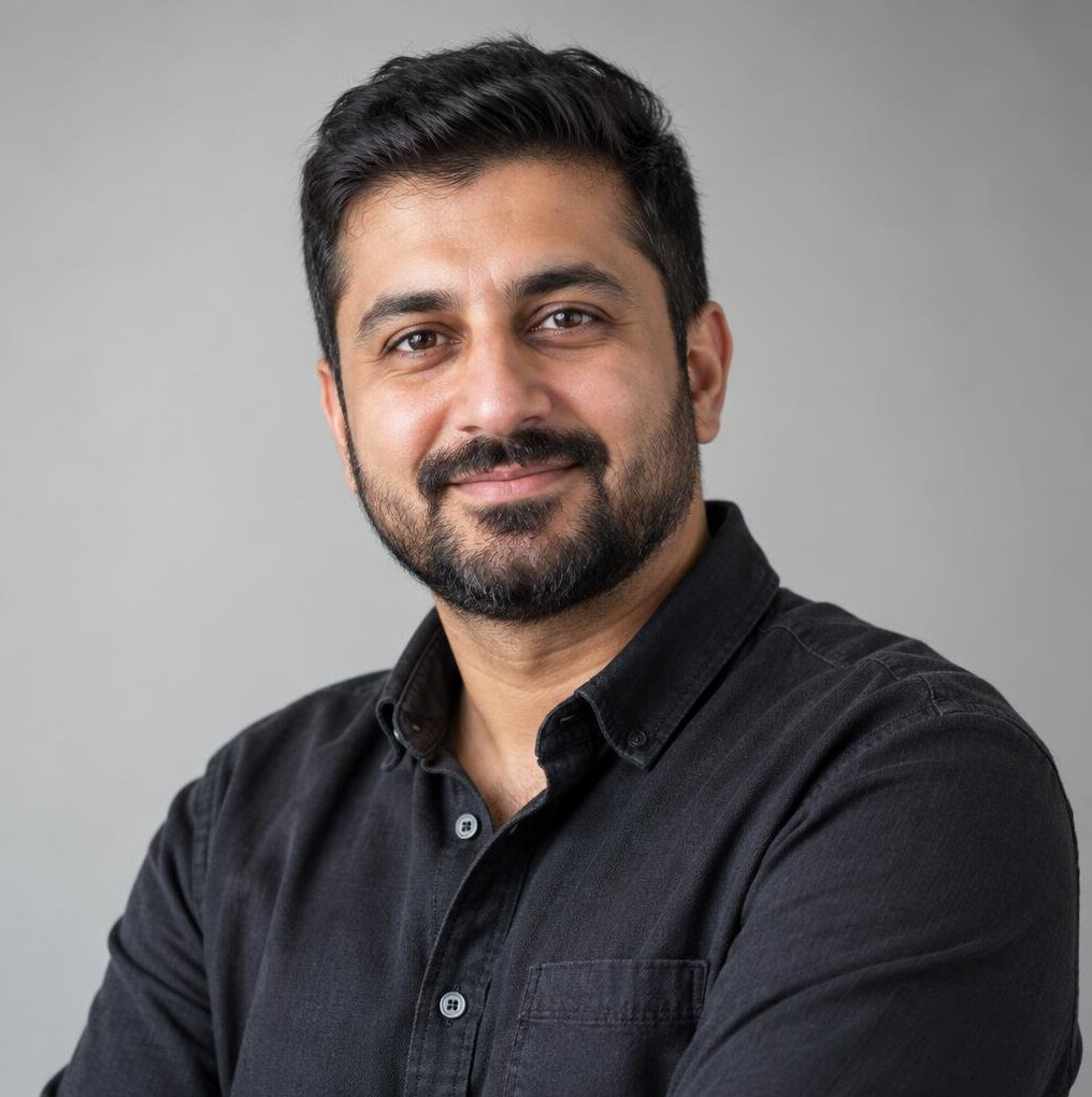 Portrait of a man in a shirt looking at the camera